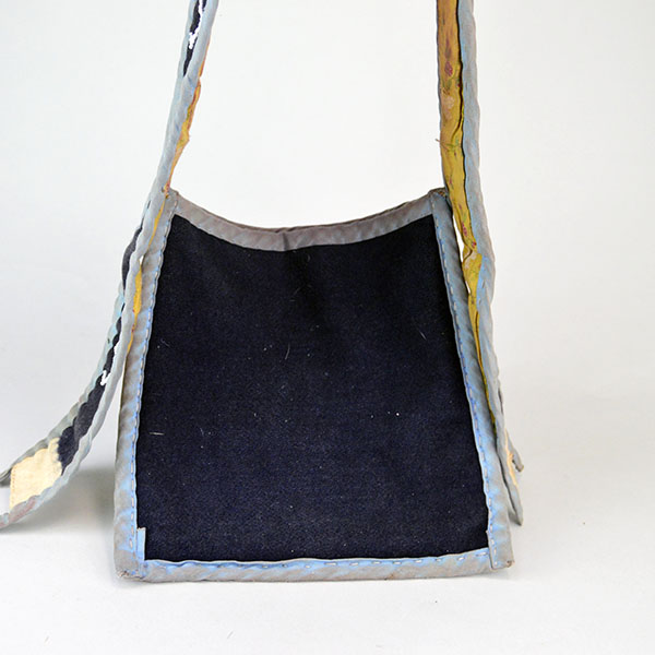 Bag- Wool Shoulder Beaded features beadwork and hand‑sewn ribbon edging. measures approx. 8.5" tall x 9" wide, shoulder strap measures 29" long. The back.