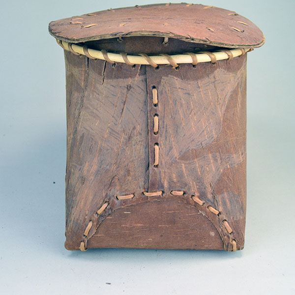 Fabulous birchbark basket with lid features hand‑etched animal designs around the container. container stands approx. 8.5"tall, 10" long by 7"wide. The side stitching,