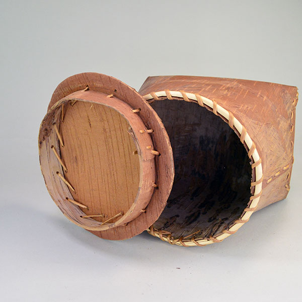 Fabulous birchbark basket with lid features hand‑etched animal designs around the container. container stands approx. 8.5"tall, 10" long by 7"wide. the cover inside.
