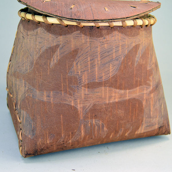 Fabulous birchbark basket with lid features hand‑etched animal designs around the container. container stands approx. 8.5"tall, 10" long by 7"wide. the side etched bear and birds.
