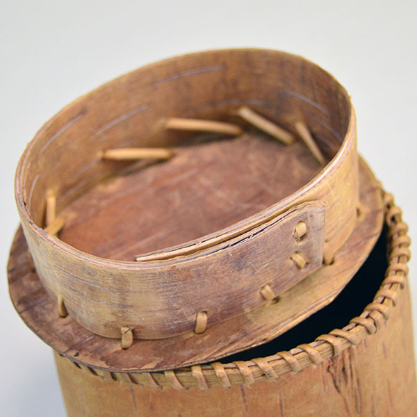 1950's tiny Basket- Birchbark with Lid. artist secured the container with traditional spruce‑root stitching. approx. 2.75" tall x 3.5" long. one of a kind. the inside of the top.