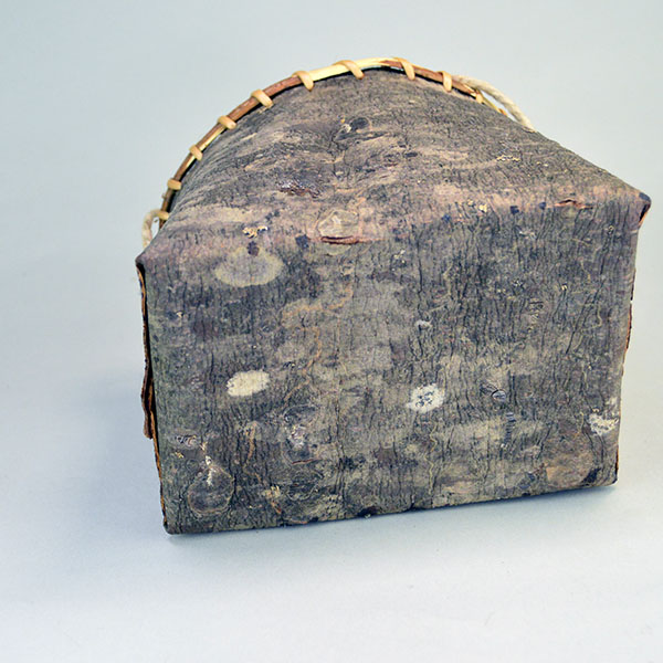 crafter Jennifer Lee created this striking Basket- Pine Bark container. approx. 6" tall with an 6" opening, the bottom is approx. 7" wide. One of a kind. The bottom.