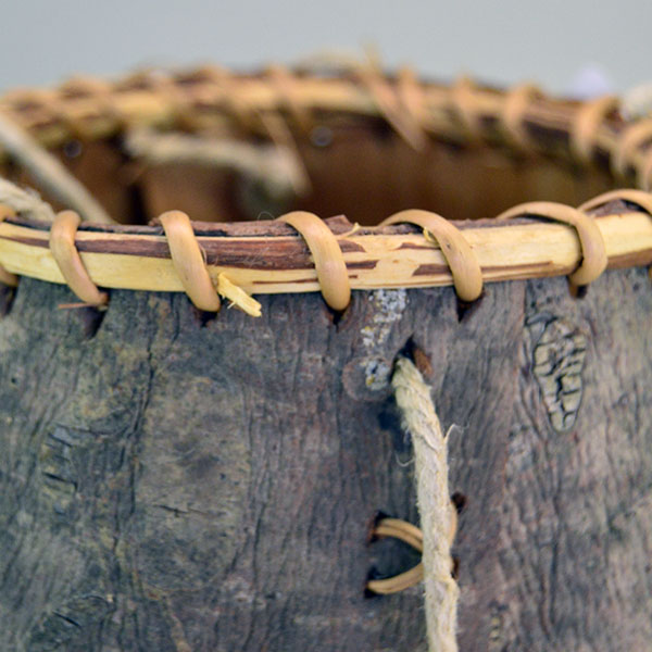 crafter Jennifer Lee created this striking Basket- Pine Bark container. approx. 6" tall with an 6" opening, the bottom is approx. 7" wide. One of a kind. the spruce root stitching.