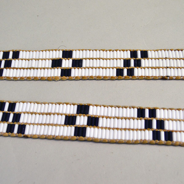 Belt Strap- Wampum 3 Row features a repeating geometric pattern. glass Wampum Beads in White and Cobalt Blue. approx. 43 Inches long x 1.25 inches wide. the pattern.