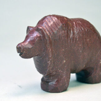 Hand‑carved Catlinite- Bear, measures approximately 3.5" long and 2.5" tall. initials “BE” on the underside, original “Indian Made Pipestone Craft” sticker.