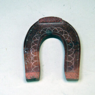 hand carved Catlinite horseshoe features hand‑etched designs on both sides. measures approximately 3.5 inches tall and 2.75 inches wide. One of a Kind.