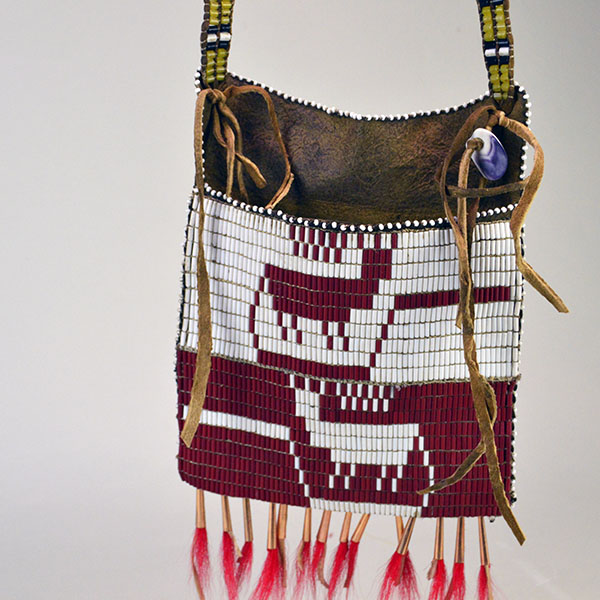 Hunting Bag Underwater Panther Design is constructed from walnut‑dyed Braintanned. measures approximately 8 by 7.5 inches. One of a Kind. The wampum beaded designs.