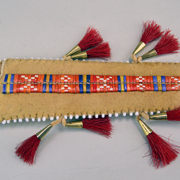 Knife- Braintanned Sheath Quilled set showcases bold color, traditional materials. The front showcases a vivid quilled design. With Knife. approx 12 inches. The quilled work.