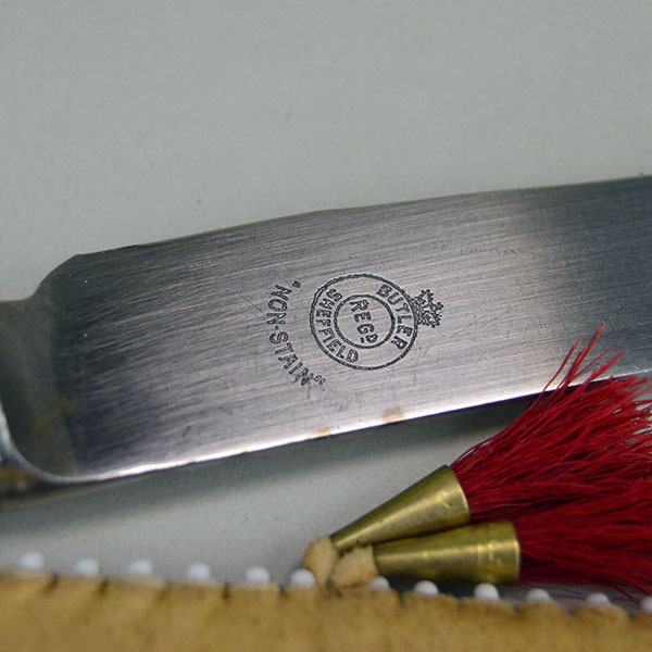 Knife- Braintanned Sheath Quilled set showcases bold color, traditional materials. The front showcases a vivid quilled design. With Knife. approx 12 inches. the name stamped on the knife.