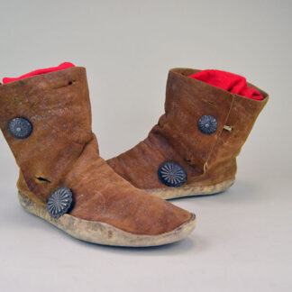 Antique Moccasin- Navajo Style High Boots feature hard rawhide soles, hand‑stitched Braintanned deer hide. Approx. 9.5" l x 3"w x 6.5" h. one of a kind.