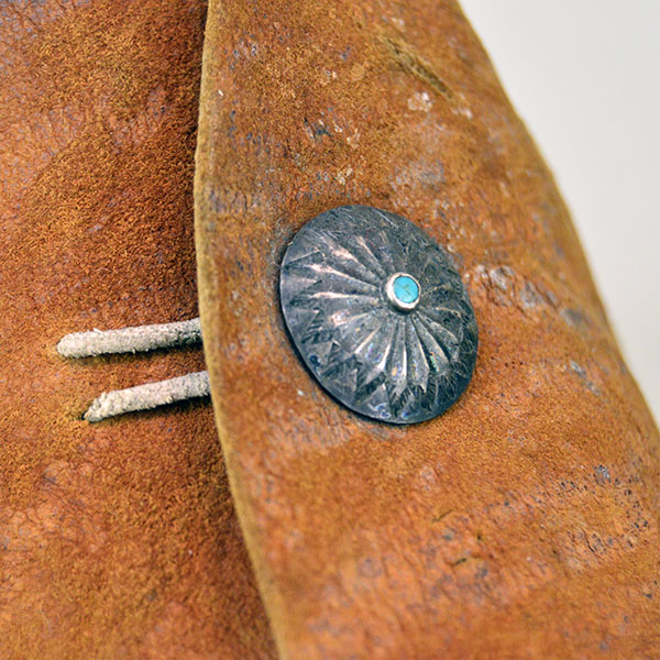 Antique Moccasin- Navajo Style High Boots feature hard rawhide soles, hand‑stitched Braintanned deer hide. Approx. 9.5" l x 3"w x 6.5" h. one of a kind. The other concho with the turquoise stone.