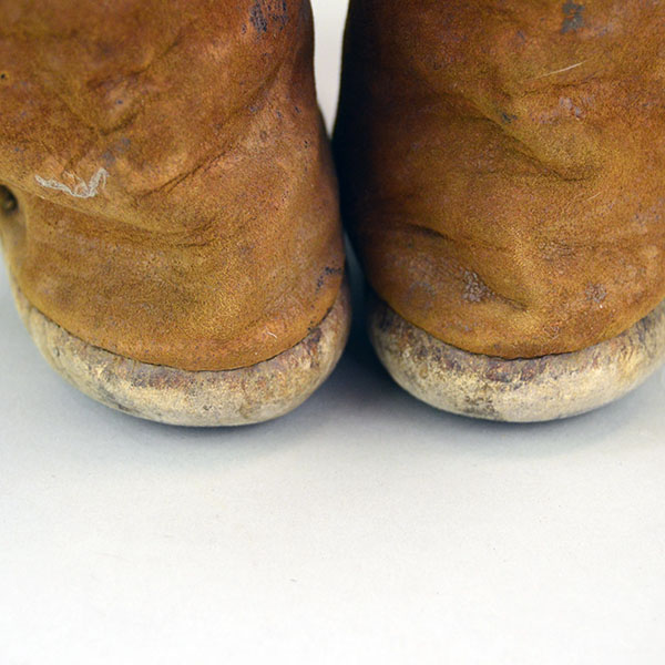 Antique Moccasin- Navajo Style High Boots feature hard rawhide soles, hand‑stitched Braintanned deer hide. Approx. 9.5" l x 3"w x 6.5" h. one of a kind. the back heals.