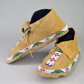 Moccasin- Northern Plains Style are beautifully crafted from soft, durable Braintanned leather. fix approx. men's 7 and women's 9. partially beaded design.