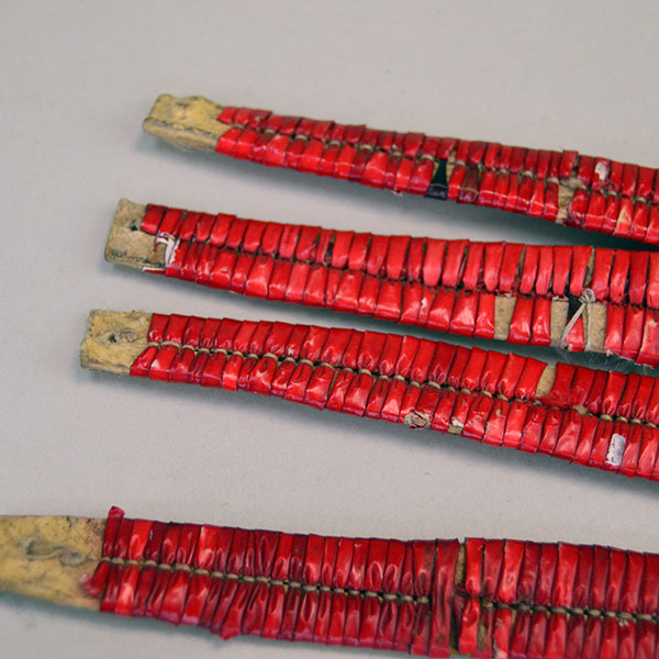 antique set of four Ornament- Quilled Tipi features vivid red‑dyed quills. Each piece measures approx. 5 inches long and 3/4 inch wide at its widest point. the other end.