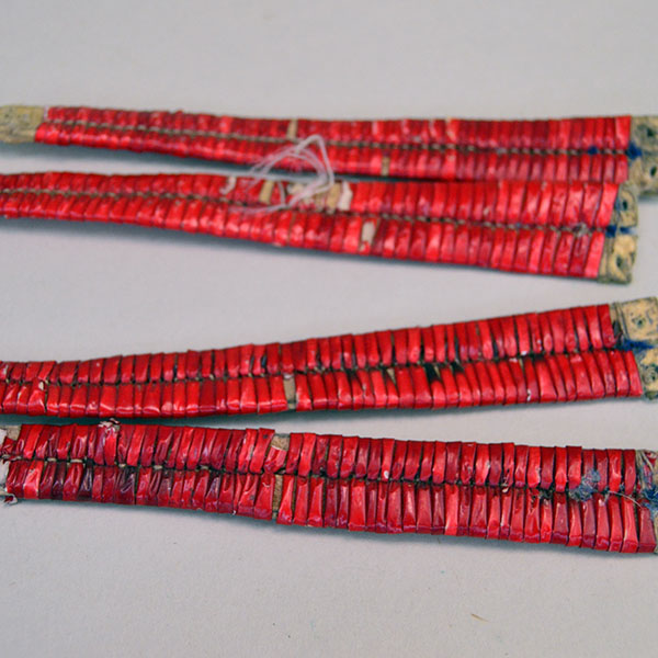 antique set of four Ornament- Quilled Tipi features vivid red‑dyed quills. Each piece measures approx. 5 inches long and 3/4 inch wide at its widest point. Picture of all four.