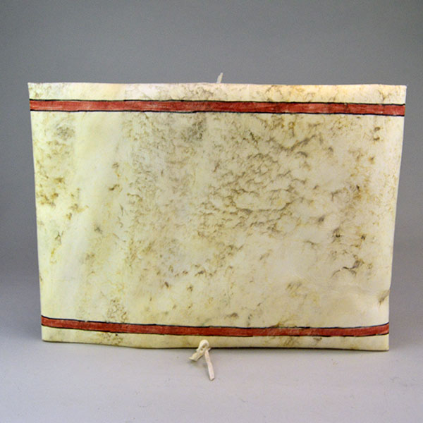Add this brightly Parfleche- Painted Rawhide Container to your collection! The container measures approx. 11" wide x 15" long. One of a Kind. The back.