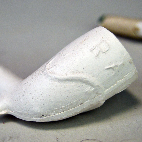 Add this Pipe- 5" Clay to your collection today. From natural white clay designs that vary from pipe to pipe. Limited stock, sold per pipe. The other side of one of the designs.