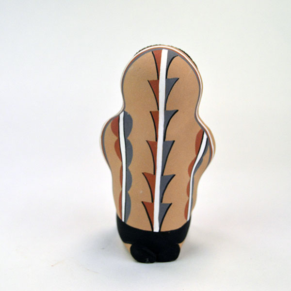 Pottery- Storyteller Pueblo presents a striking, expressive pose that captures the viewer’s attention. Signed base ‘EF Tsosie , Jemez. approx. 6.5" tall. The back view.