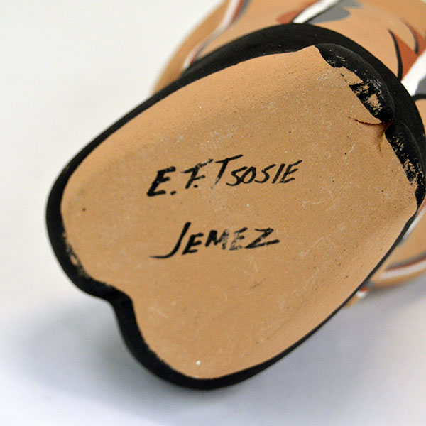 Pottery- Storyteller Pueblo presents a striking, expressive pose that captures the viewer’s attention. Signed base ‘EF Tsosie , Jemez. approx. 6.5" tall. the signature on the bottom.