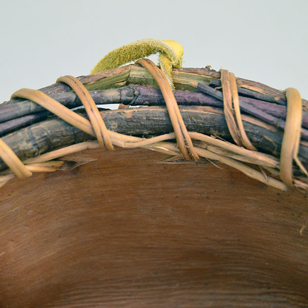 This Jennifer lee Water Bowl- Pine Bark delivers standout craftsmanship. approx. 5" across the bottom and 3.5 inches tall, 7 inches in width at the top. The spruce root stitching and the arrowwood rim.