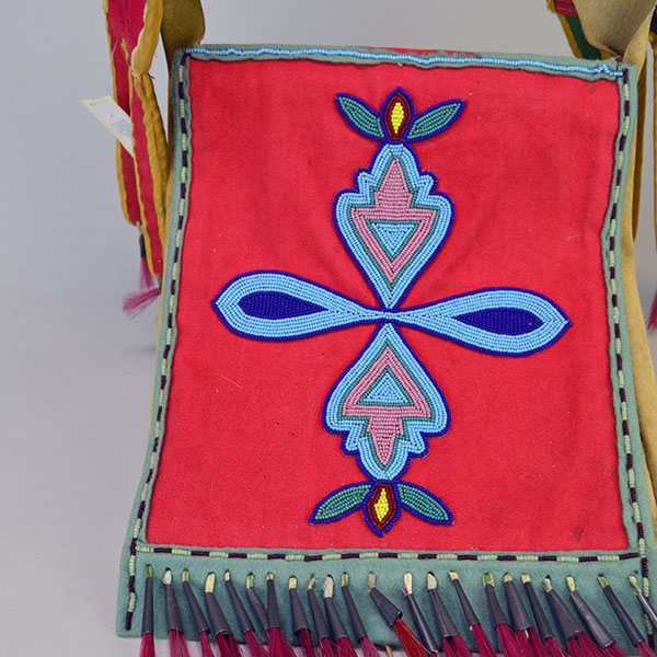 This Bag- Great Lakes Style showcases bold 11/0 seed bead floral and geometric designs. measures approx. 10" wide X 11" long, and the strap 28.5 " long. The front beaded design.