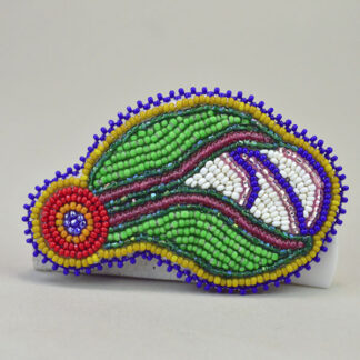 Handcrafted Barrette- Beaded Flower by Andy Bullock, featuring vibrant French repro beads and a bold three‑dimensional edge. Approx. 3.5" x 2.25″ .