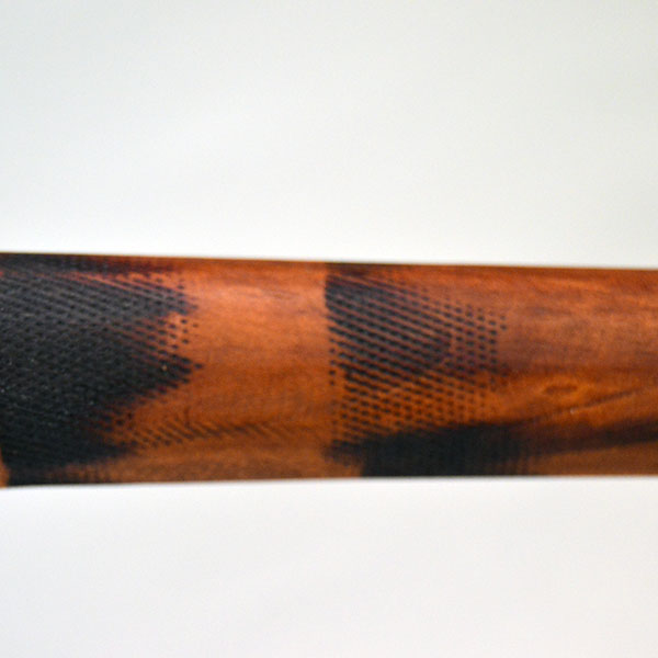 This 18-inch straight wooden club reflects Chris Bullock’s refined fire‑burnishing technique. Chris applied mineral oil, to enriching the color. The two tone of the burnished handle.