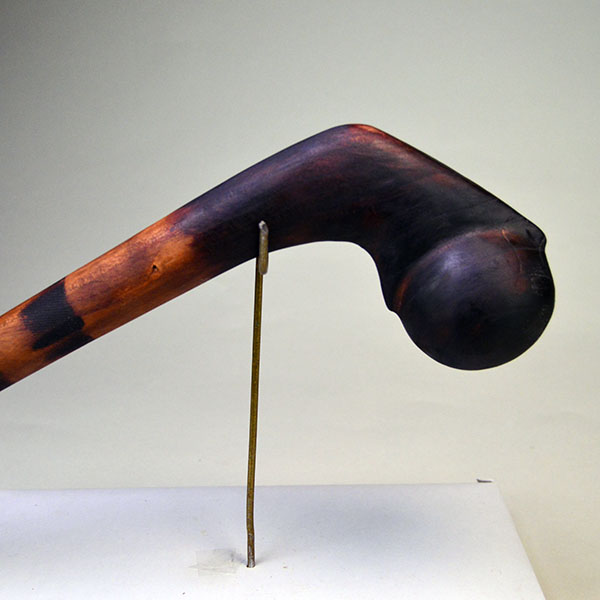 This 18-inch straight wooden club reflects Chris Bullock’s refined fire‑burnishing technique. Chris applied mineral oil, to enriching the color. The burnished look of the club.