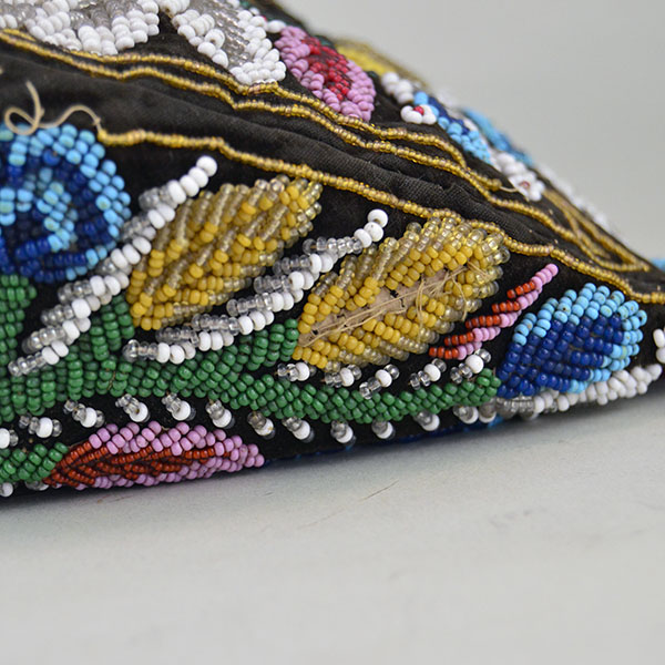 Antique Hat- Antique Beaded Glengarry, brown velveteen cap with a classic Iroquois‑style floral motif. hat shows wear, some bead loss. One of a Kind. a side view of the floral design.