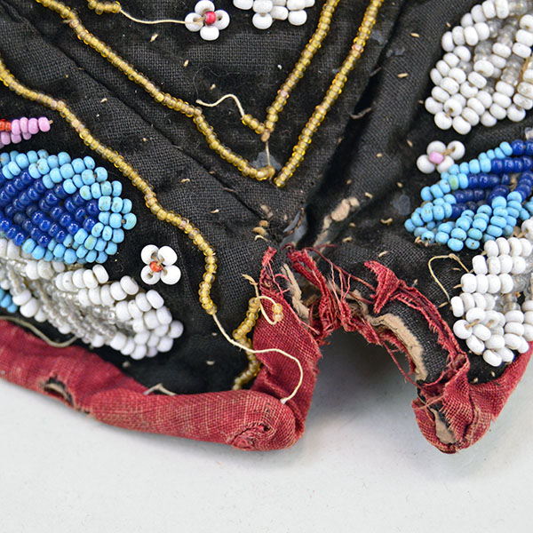 Antique Hat- Antique Beaded Glengarry, brown velveteen cap with a classic Iroquois‑style floral motif. hat shows wear, some bead loss. One of a Kind. The tail of the cap. showing stitching coming apart.