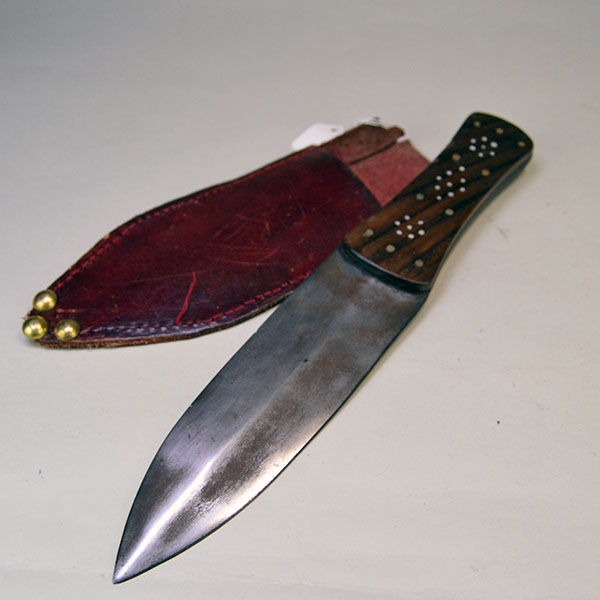 Knife- Beaver Tail Style with Decorative Brass‑Pinned Handle and Reinforced Leather Sheath. Approx. 7" double-edged Blade, and 5" handle . One of a Kind.