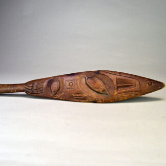 Unique antique Northwest Coast paddle, measuring approx. 15" long and about 2.75". Scratches and wear consistent with age enhance its authentic character.