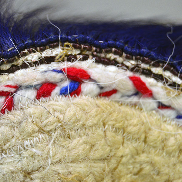 14" Dark Blue Roach is a well‑constructed, eye‑catching piece. Handmade braided‑yarn base, dark blue on the outside and white on the inside. The rows on the front.