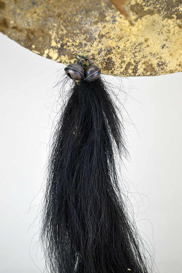 Striking shield features a 15″ buffalo‑rawhide body, quilled medicine wheel, Two old turkey feathers, a hose tail. One of a Kind. The horse tail.