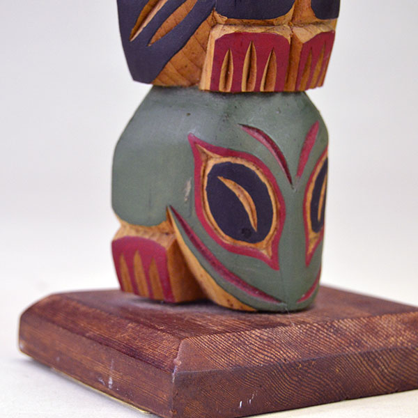 Hand‑carved Totem Pole 9" features a bear on top and a frog at the base. back is etched ‘L. Rudick,’ , is Larry Rudick is a Pacific Northwest carver. The frog on the bottom.