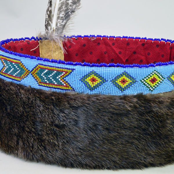 Striking Turban- Beaded with Otter will make a standout addition to your regalia. A vintage 1.5‑inch beaded strip on top, 23" in inside circumference. a side view.