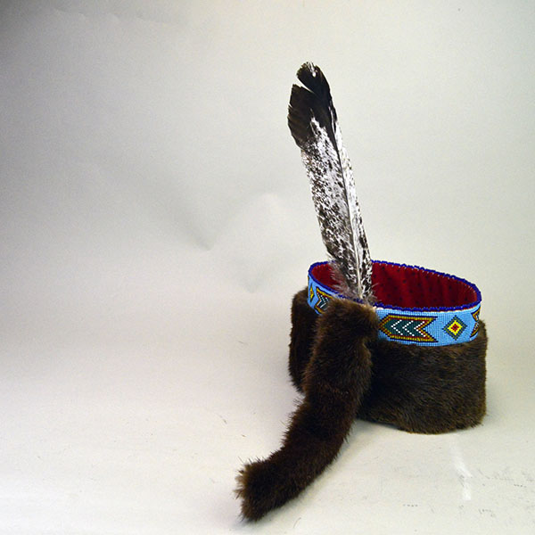 Striking Turban- Beaded with Otter will make a standout addition to your regalia. A vintage 1.5‑inch beaded strip on top, 23" in inside circumference. the back side.
