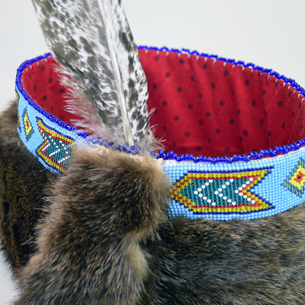 Striking Turban- Beaded with Otter will make a standout addition to your regalia. A vintage 1.5‑inch beaded strip on top, 23" in inside circumference. The drop next to the beaded strip.