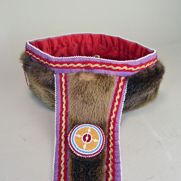 Turban Crafted in Otter Fur features six rosettes measuring between 1.25" x 2.5". approx. 21.5 inches inside circumference, drop measures about 24 inch". The back of the turban.