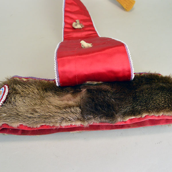 Turban Crafted in Otter Fur features six rosettes measuring between 1.25" x 2.5". approx. 21.5 inches inside circumference, drop measures about 24 inch". The outside where the drop and the turban meet.
