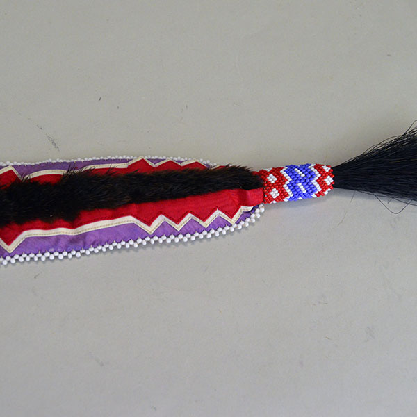 Turban- Handcrafted Otter fur features six rosettes. approximately 22 inches in inside circumference. The drop measures about 26 inches. one of a kind. The peyote stitch and the horse hair at the end of the drop.