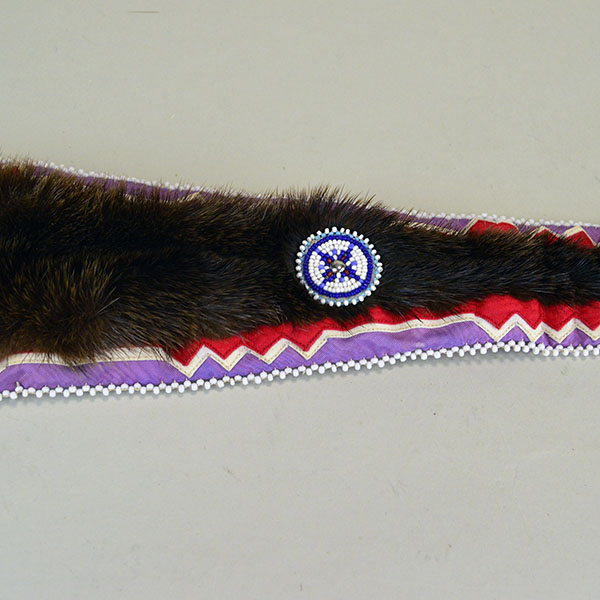 Turban- Handcrafted Otter fur features six rosettes. approximately 22 inches in inside circumference. The drop measures about 26 inches. one of a kind. the smaller rosette, and the ribbon work on the drop.
