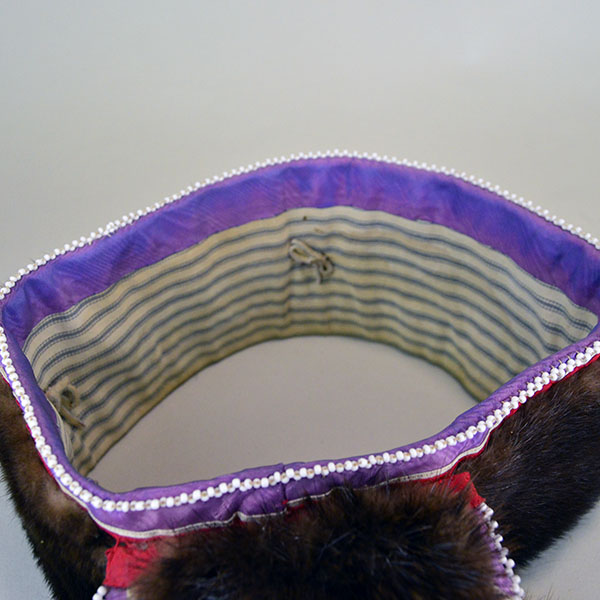 Turban- Handcrafted Otter fur features six rosettes. approximately 22 inches in inside circumference. The drop measures about 26 inches. one of a kind. The inside lining.