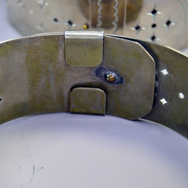 Handmade German Silver Armbands- Star Motif with a punched star design; adjustable 1.25" x 14" bands crafted for Powwow regalia and Living History wear. The inside of the armband for making smaller and larger