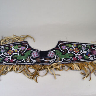 Antique Cree‑style floral beaded jacket shoulder panel with Braintanned fringe, black velvet, bead loss, and ribbon wear; measures 26 inches long.