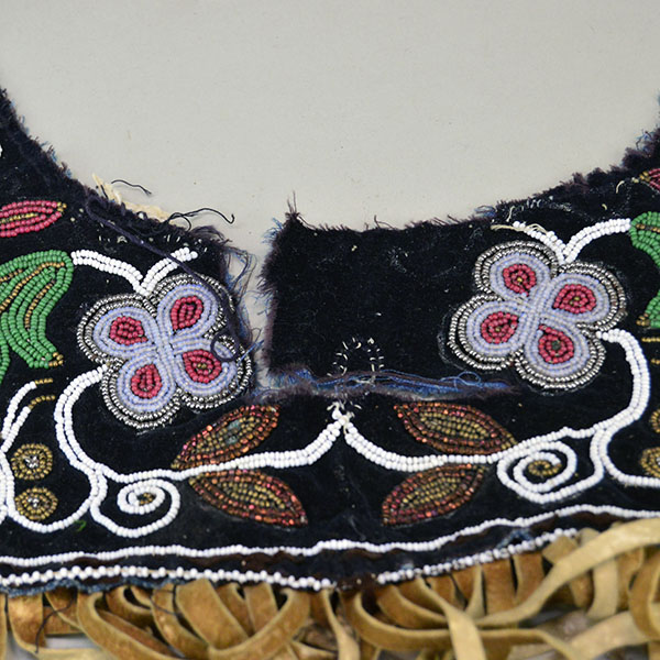 Antique Cree‑style floral beaded jacket shoulder panel with Braintanned fringe, black velvet, bead loss, and ribbon wear; measures 26 inches long. Where the black velvet have come apart.