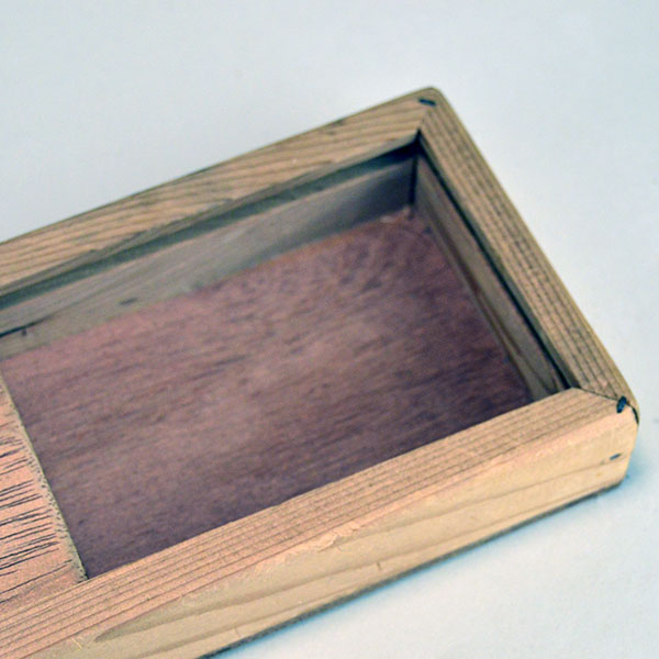 Box- Cedar Slide Top that protects feathers from pests and damage. Smooth lid with no hinges. Exterior measures 17" long, 4" wide, and 1.5" deep. The inside view.