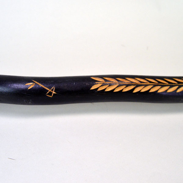 Vintage birch Cane- Indian Head & Leaves, approx. 36" long and 1.5" wide, featuring a hand‑chipped portrait, chipped leaf designs, hand‑painted details. The other end of the chipped design on the back.