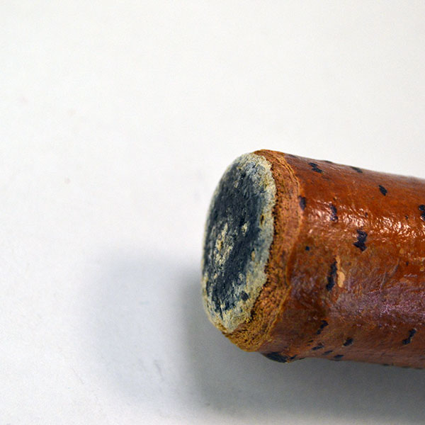 Vintage birch Cane- Indian Head & Leaves, approx. 36" long and 1.5" wide, featuring a hand‑chipped portrait, chipped leaf designs, hand‑painted details. The bottom of the cane.