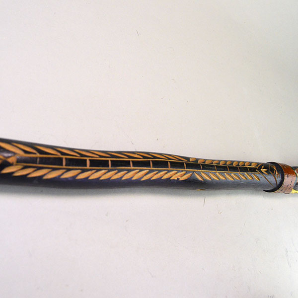 Vintage birch Cane- Indian Head & Leaves, approx. 36" long and 1.5" wide, featuring a hand‑chipped portrait, chipped leaf designs, hand‑painted details. Picture of the chipped design down the front of the whole cane.